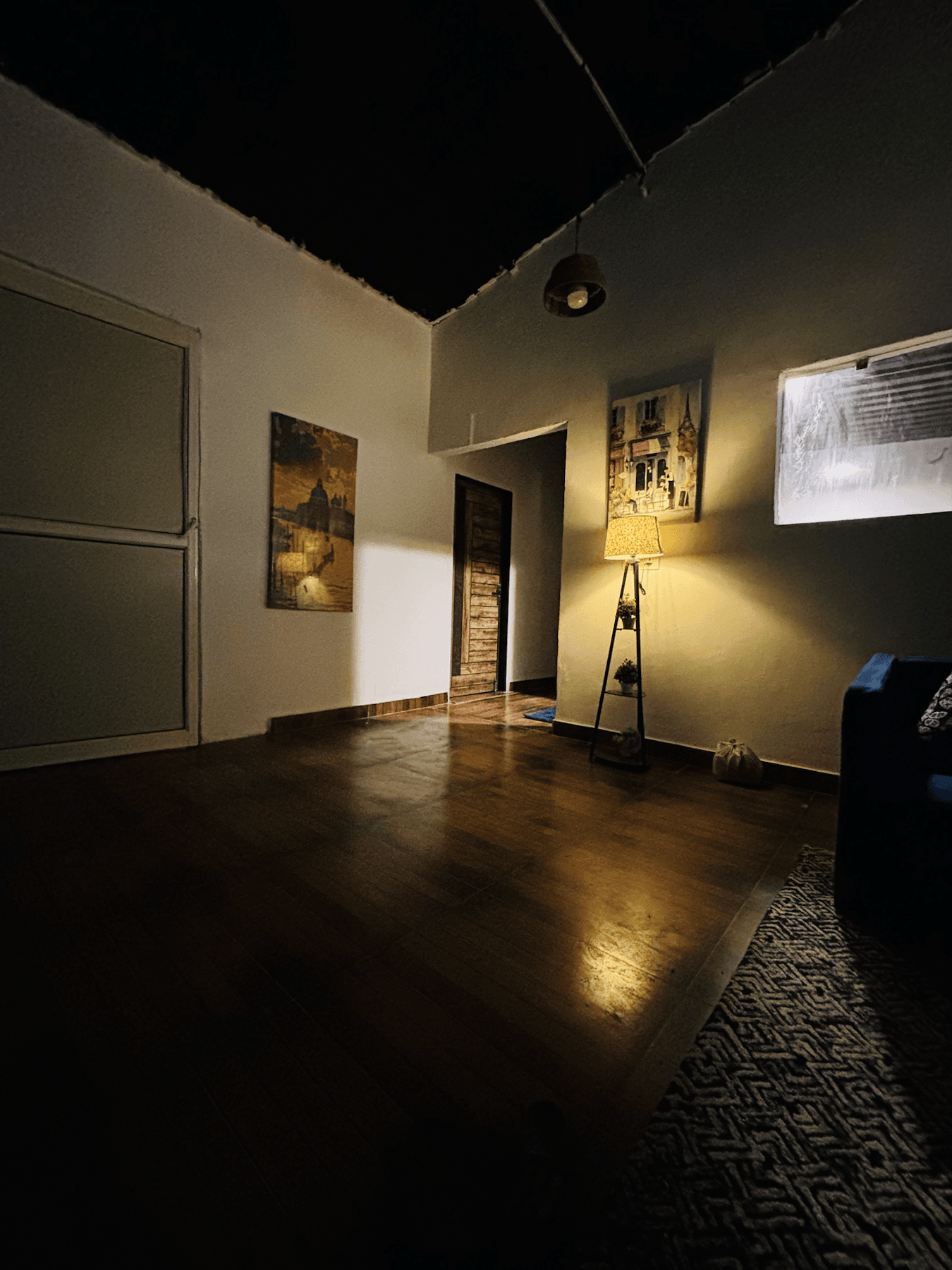 Bedroom interior with warm lighting and wooden flooring